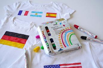 Mit Flaggen bemalte T-Shirts und das KREUL Textil Marker medium Junior 12er Set